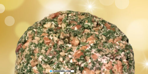 smoked salmon cheese ball with a glittery background