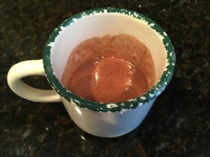 cake in a mug ready for microwave