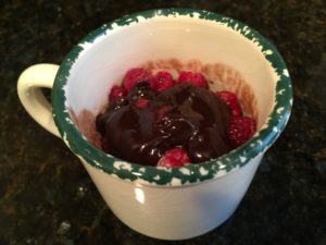 cake in a mug with toppings