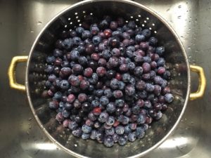 canned blueberry syrup blueberries in colander