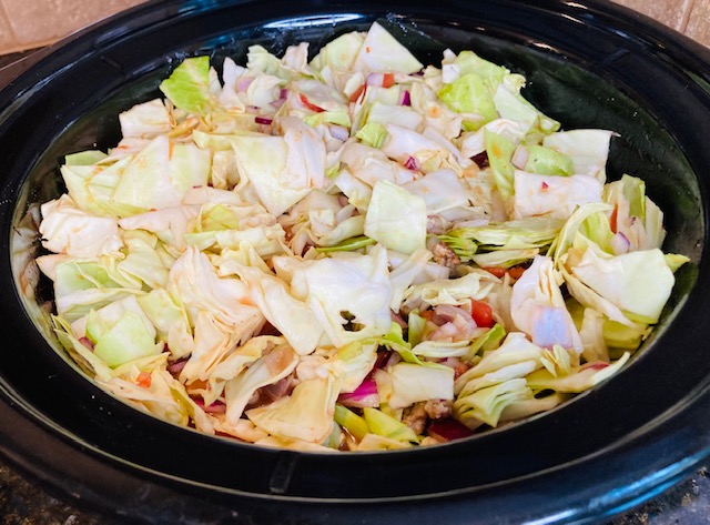 Crock pot cabbage soup with sausage in the pot