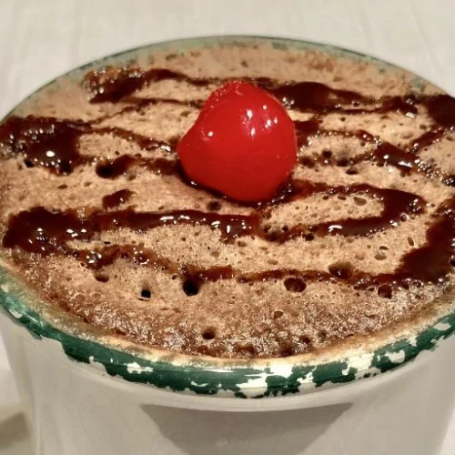 Super simple mug cake featured image chocolate mug cake with cherry on top