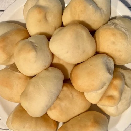 recipe for bread machine rolls baked on a plate