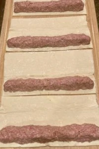mini sausage rolls sausage on puff pastry sheets