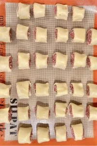 mini sausage rolls on silicone liner