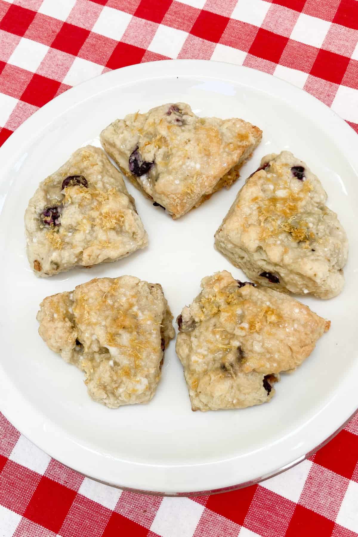 glazed lemon blueberry scones without heavy cream on a plate