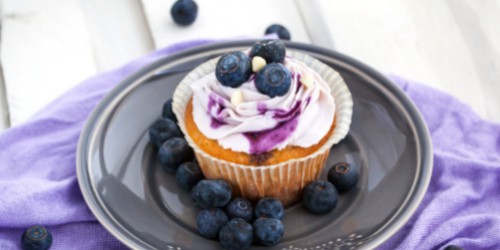 easy blueberry party theme ideas blueberry-topped cupcake