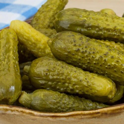 cute pickles gherkins by the pint served in a bowl