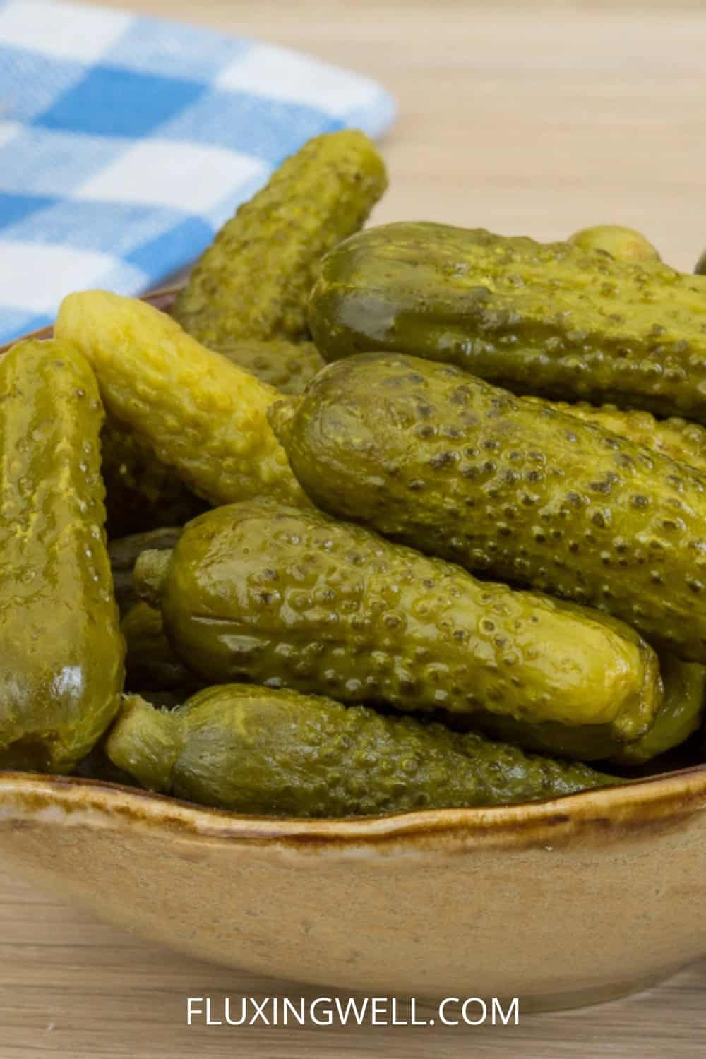 cute pickles gherkins by the pint served in a bowl