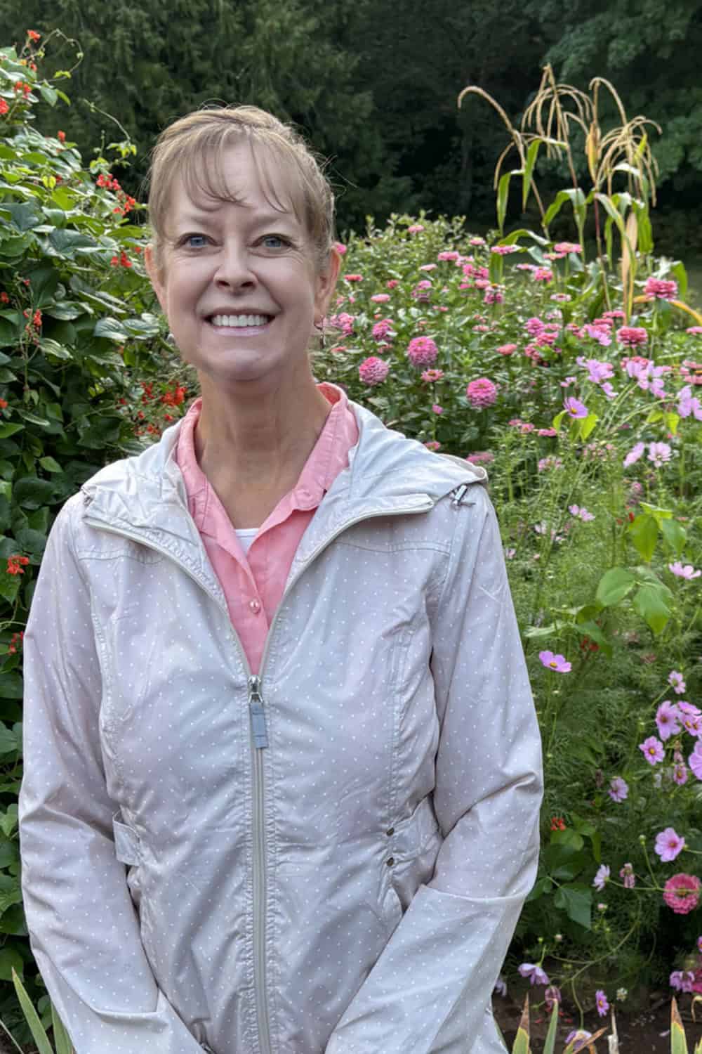 Cosmos companion plants author standing by cosmos