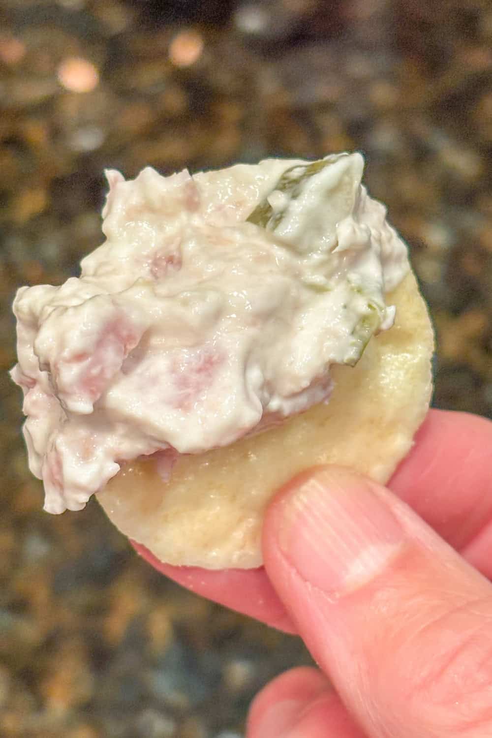 dill pickle and ham dip on a cracker